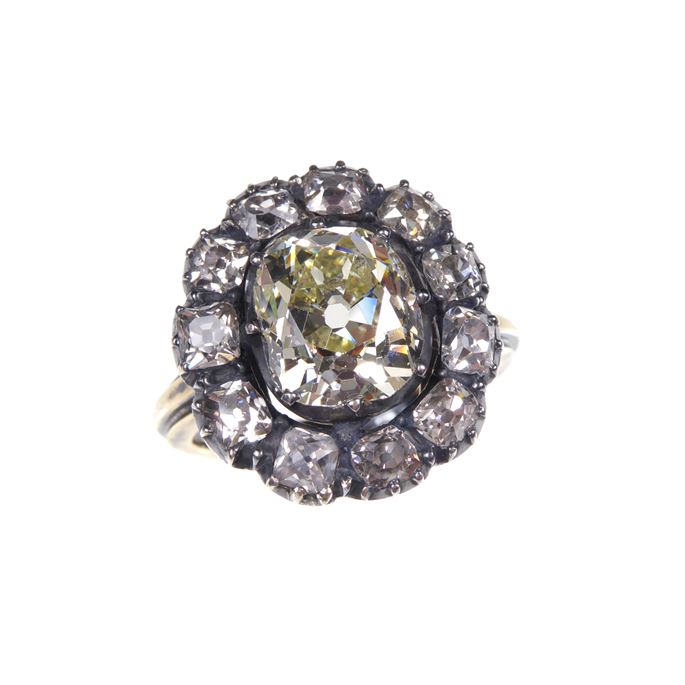 Antique diamond cluster ring, large central cushion cut diamond surrounded by 12 smaller diamonds, gold and silver set | MasterArt